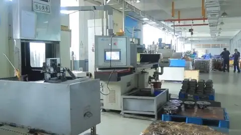 Industrial equipment with a control panel, with pallets and components beside it