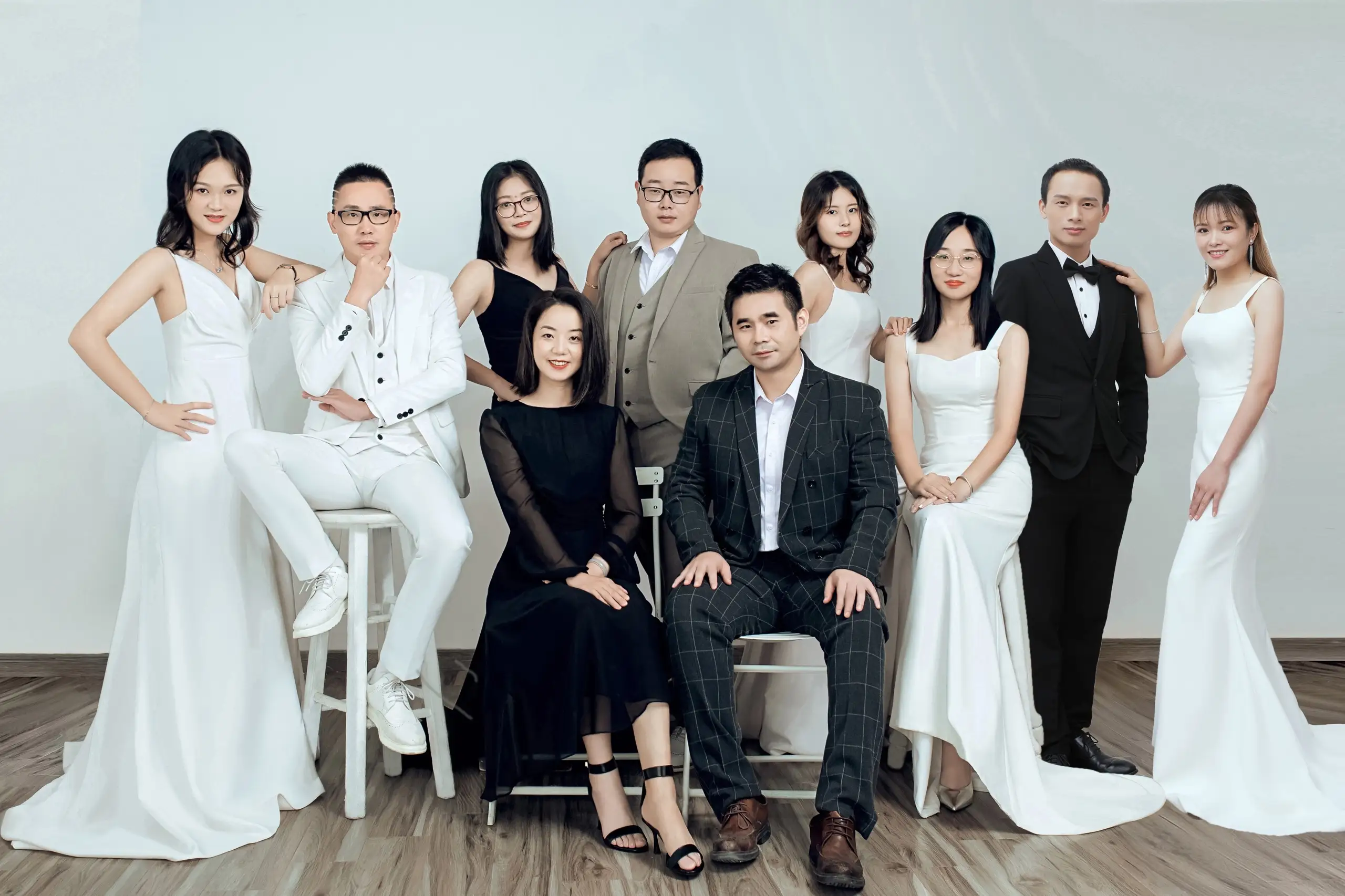 Studio portrait of the Kyotechs team in formal dress
